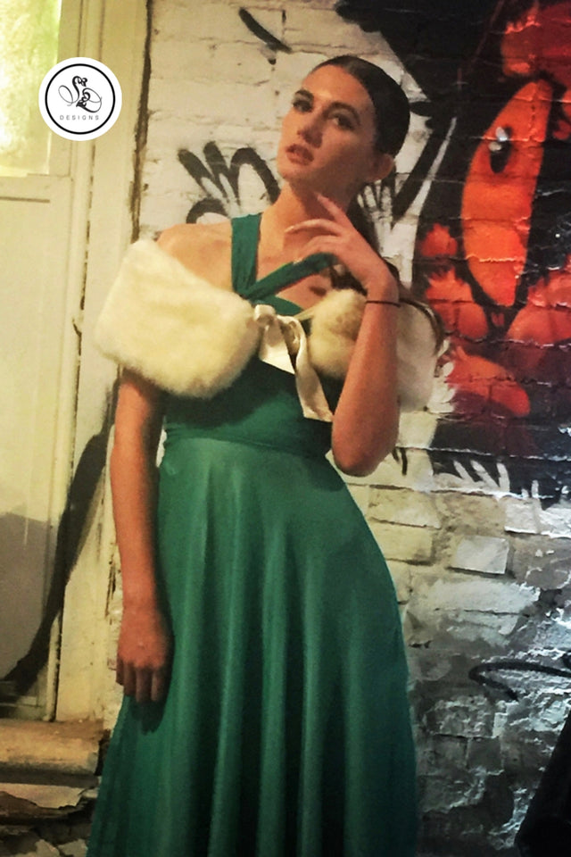 sheridonna designs bias cut turquoise gown with no sleeves for the top layer and ivory satin skirt with a mini train