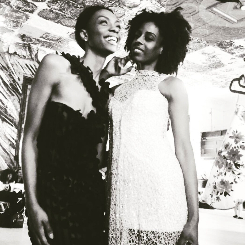 2 beautiful chocolate models wearing SHERIDONNA DESIGNS WEDDINGS DRESSES , one black and one ivory