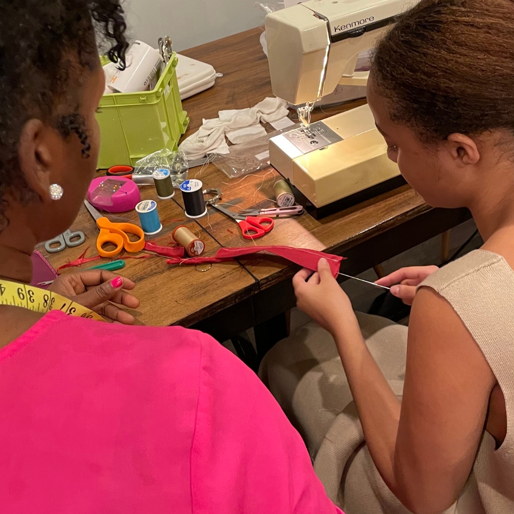 Ufi student learning sewing